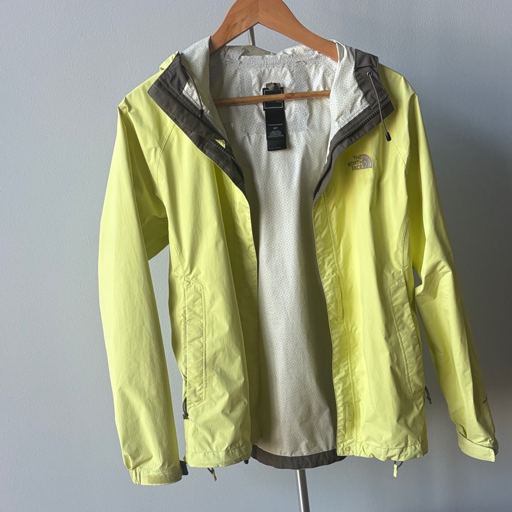 The North Face yellow rain jacket